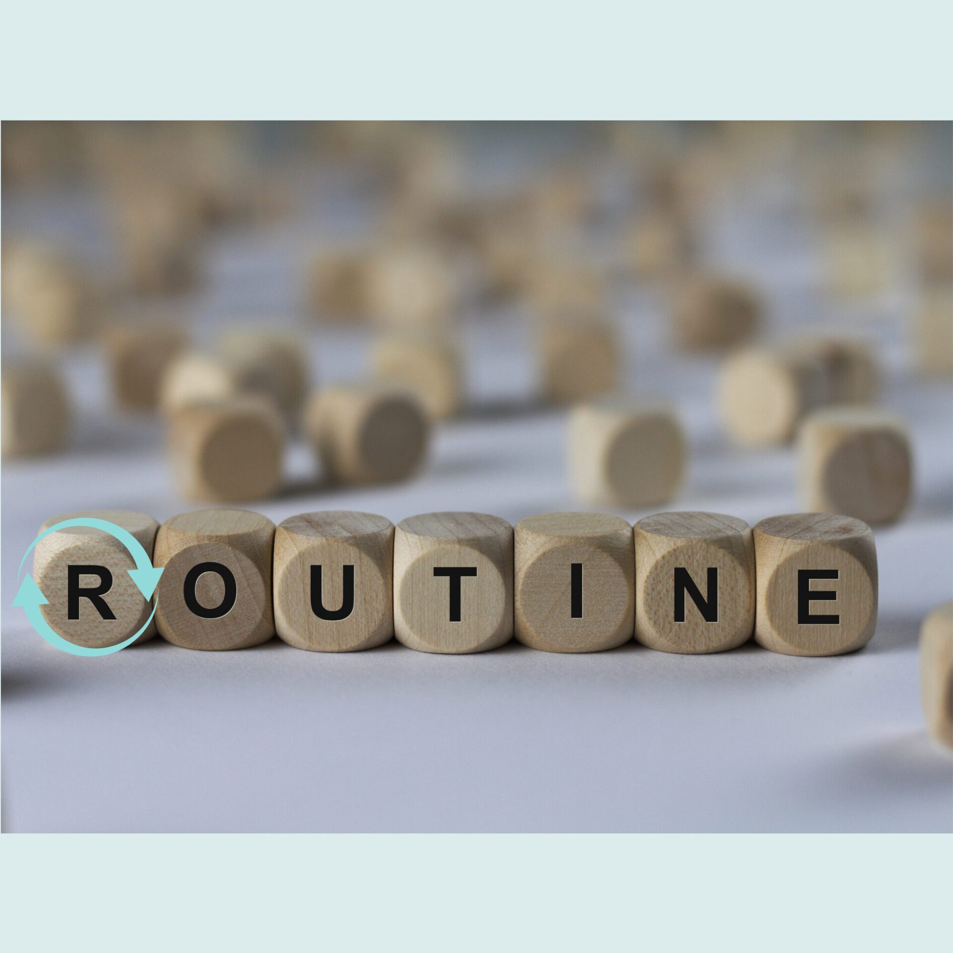 Würfel mit den Worten "Routine"